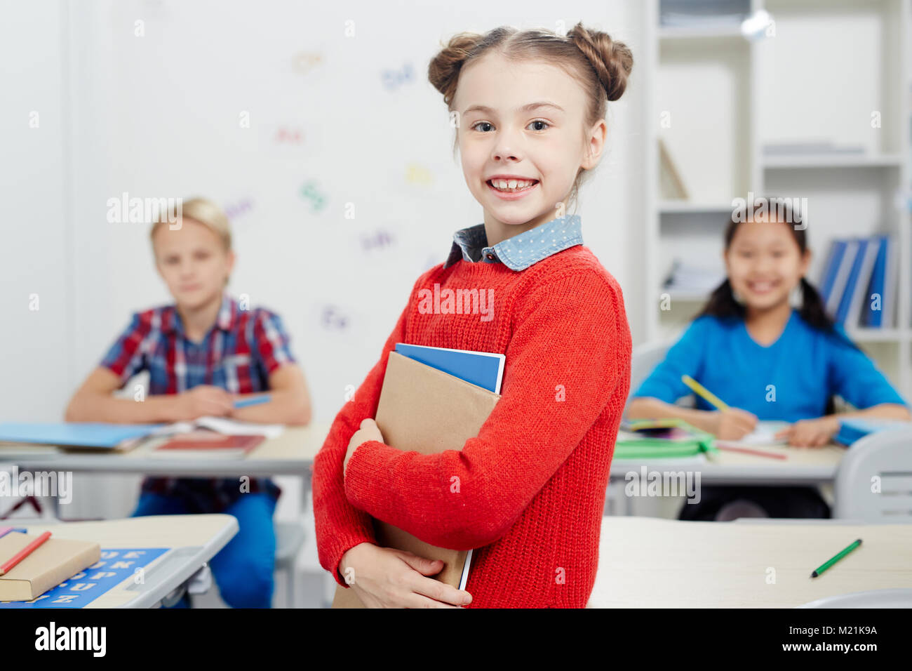 Schoolgirl with books Stock Photo - Alamy
