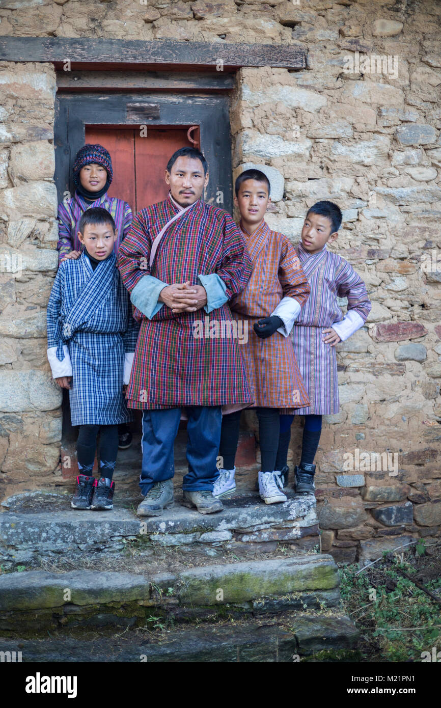 Prakhar Lhakhang, Bumthang, Bhutan.  Bhutanese family in Traditional Dress (Gho). Stock Photo