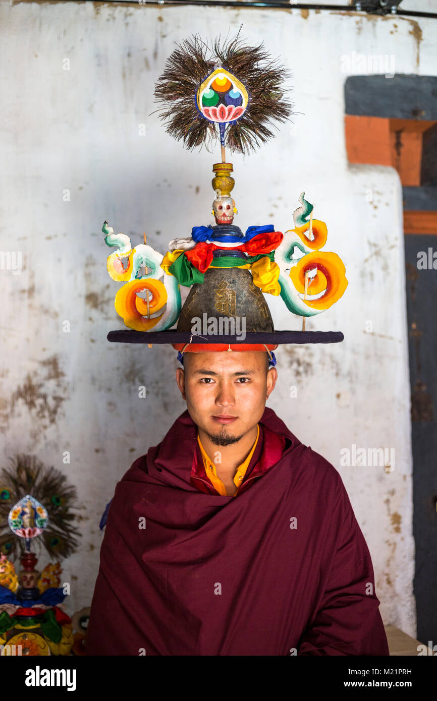 Prakhar Lhakhang, Bumthang, Bhutan.  Young Monk Posing with his Headpiece before a Dance. Stock Photo