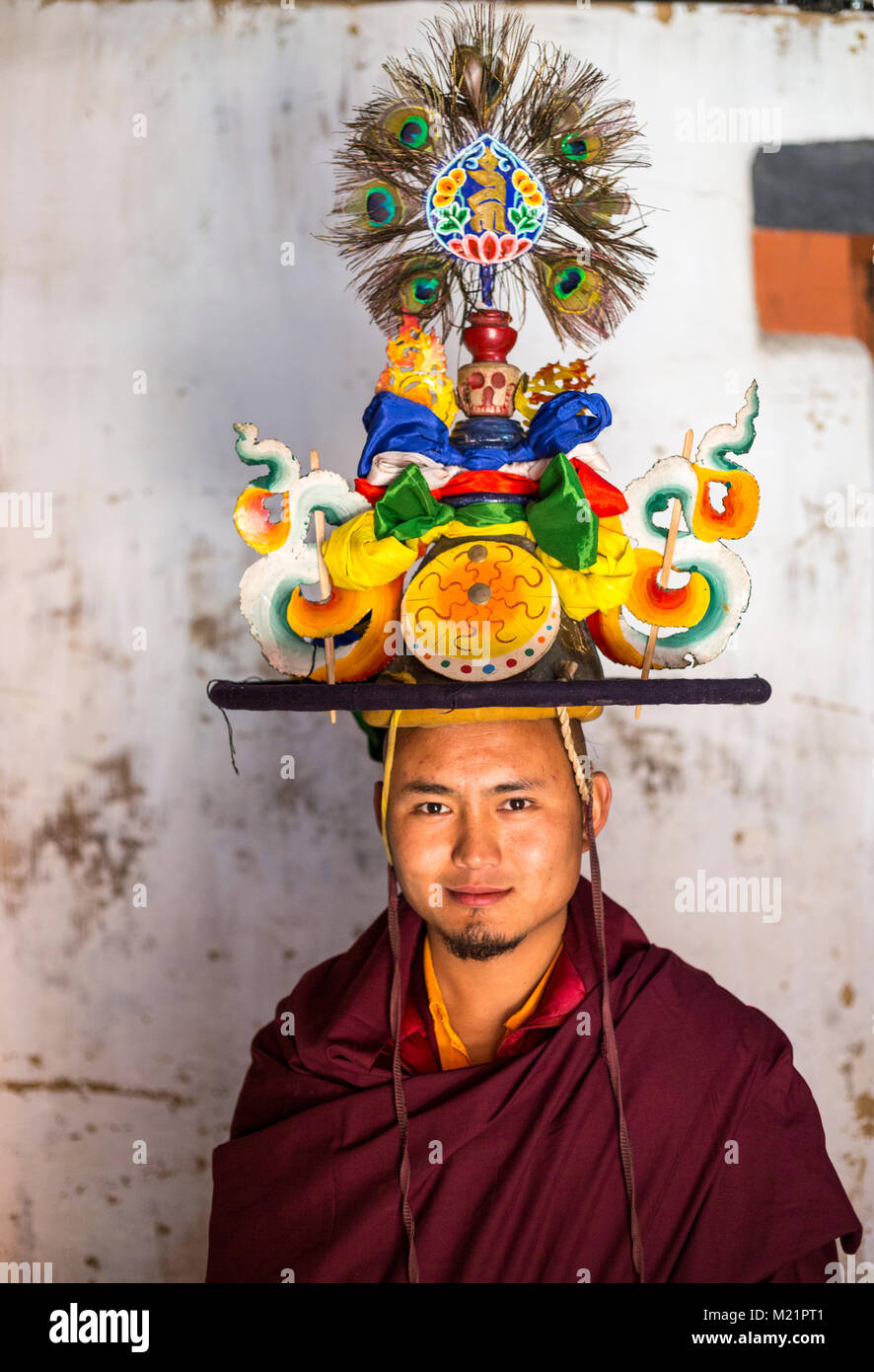Prakhar Lhakhang, Bumthang, Bhutan.  Young Monk Posing with his Headpiece before a Dance. Stock Photo
