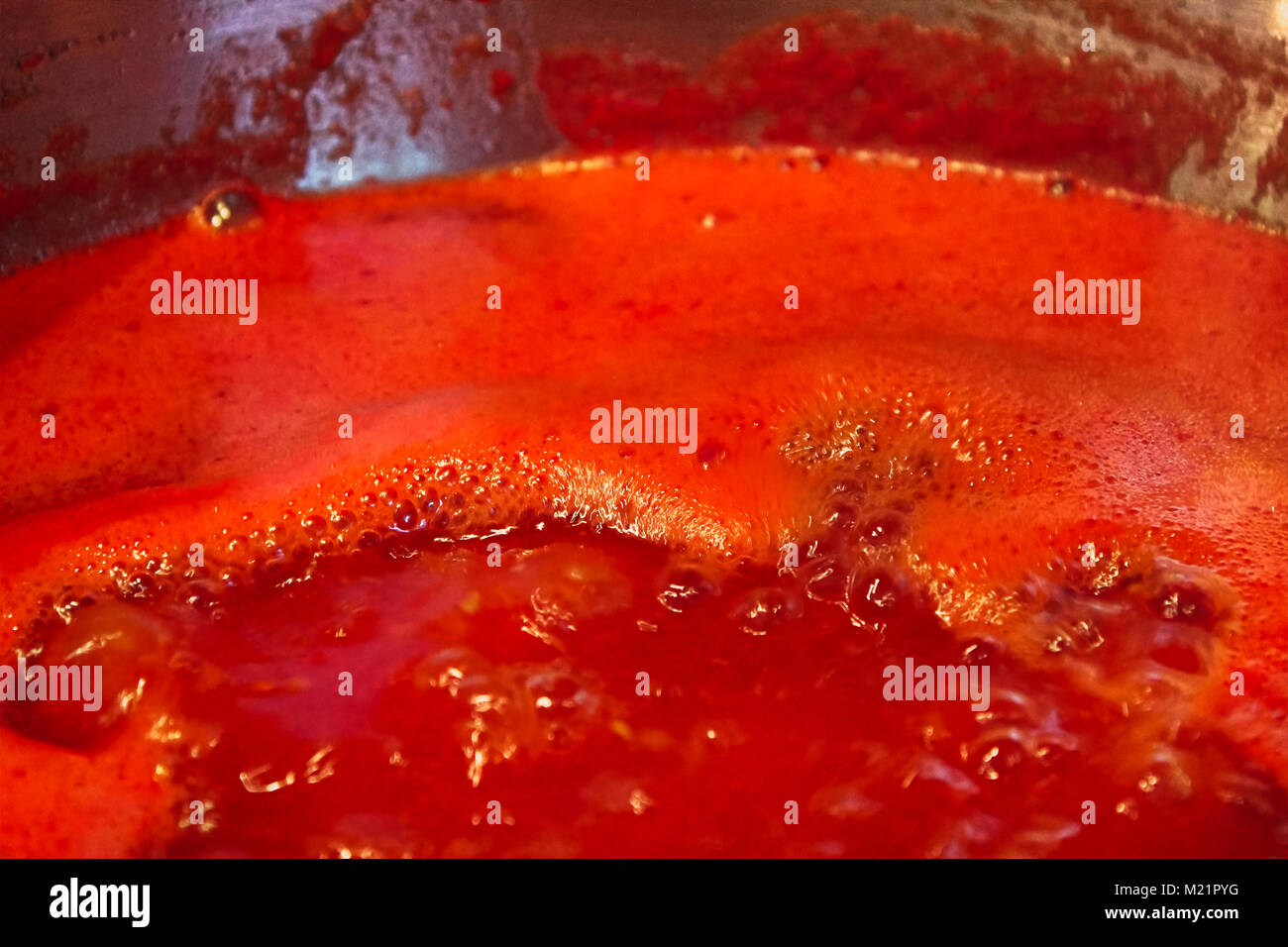 Closeup of tomato sauce boiling and reducing down Stock Photo Alamy
