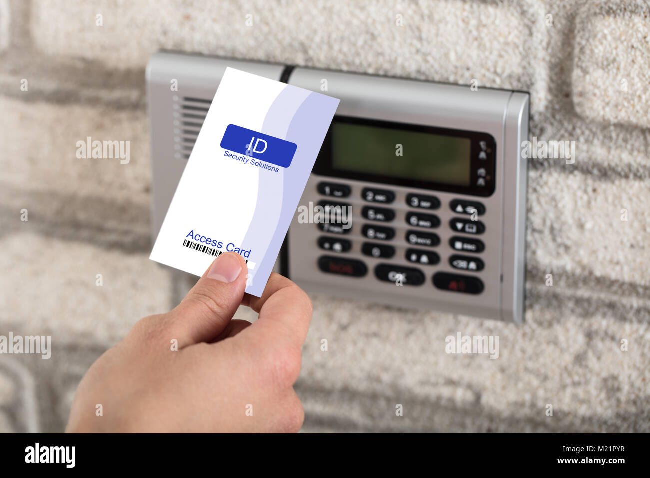 A Person S Hand Holding Access Card To Lock And Unlock Door