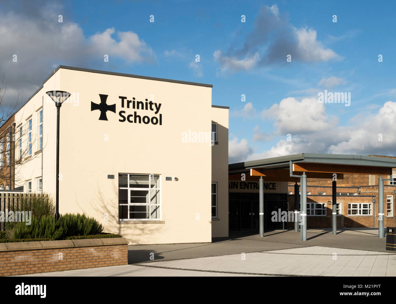 The main entrance of Trinity School, a Church of England Academy or faith school, Carlisle, England, UK Stock Photo