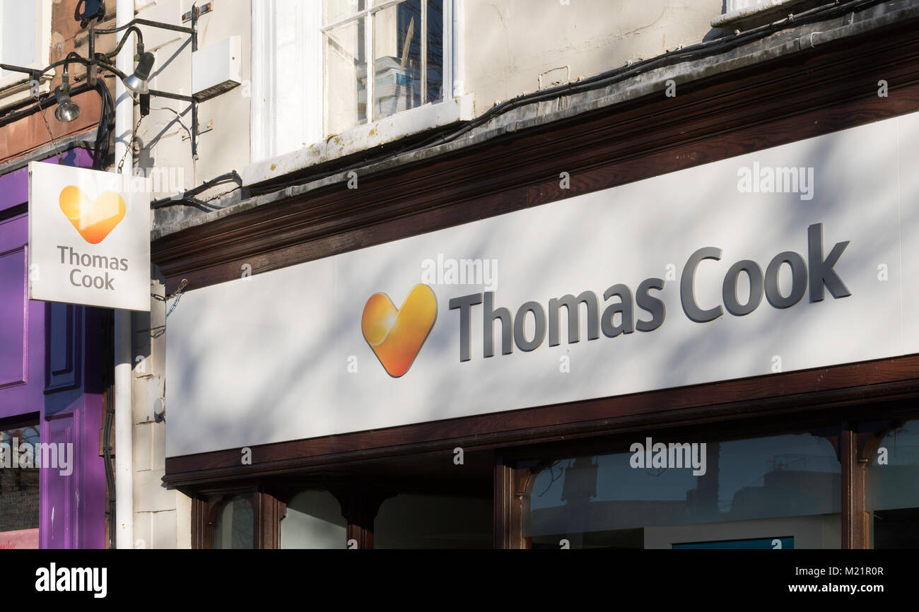 Thomas Cook sign and logo above their Carlisle travel shop, Cumbria, England, UK Stock Photo