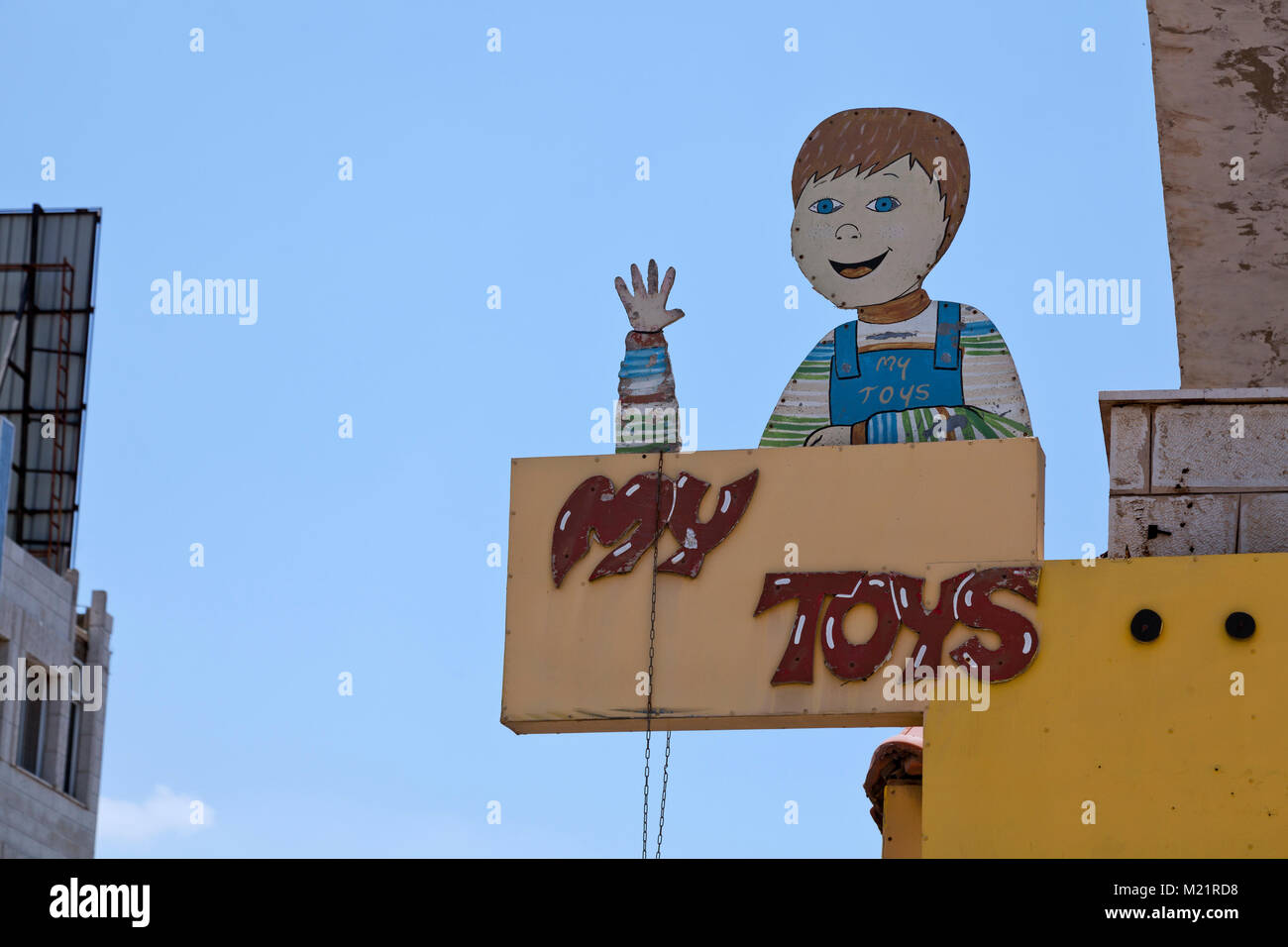 Ramallah, Palestine, July 7, 2014: Hilarious design of a toy shop billboard in Palestine Stock Photo