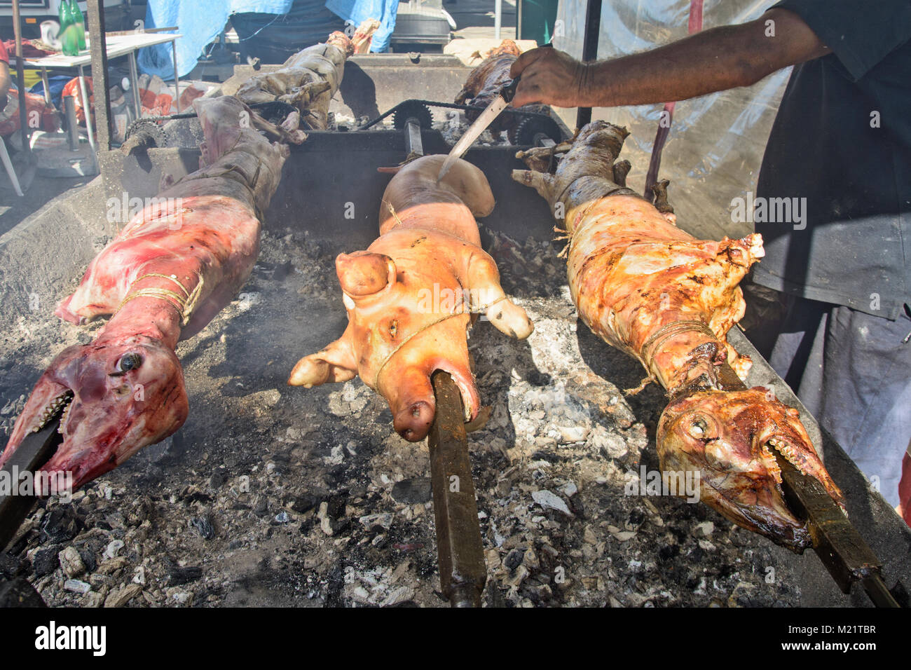 Outdoors lamb and pig roast on the grill in order to sell meat Stock