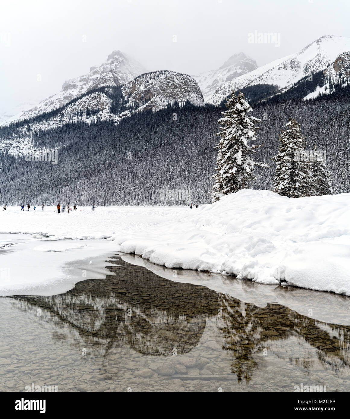 Panorama format photo of a winter scene on the frozen Lake Louise and ...
