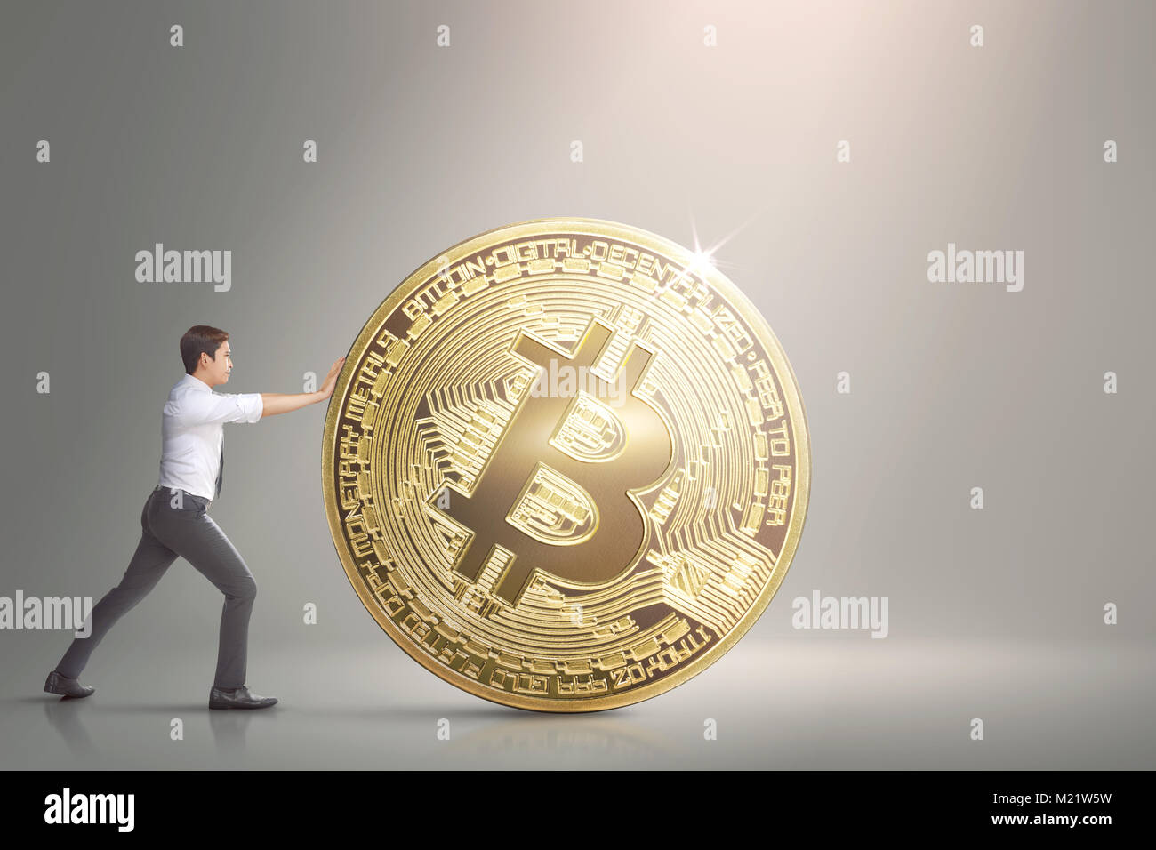Image of asian business man pushing bitcoin Stock Photo - Alamy