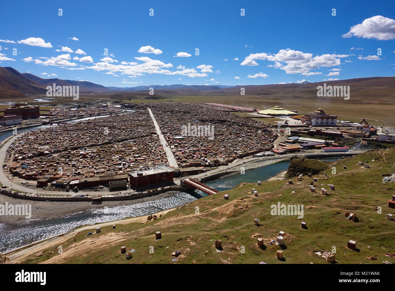 View of the Yarchen Gar Monastery with many shacks for monks in Garze Tibetan, Sichuan, China. Stock Photo
