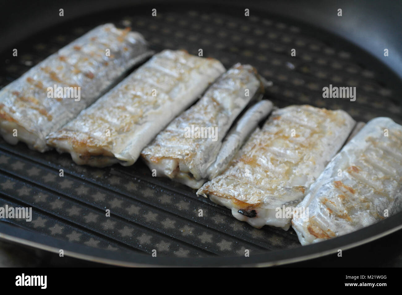 Grilled fish on pan Stock Photo - Alamy