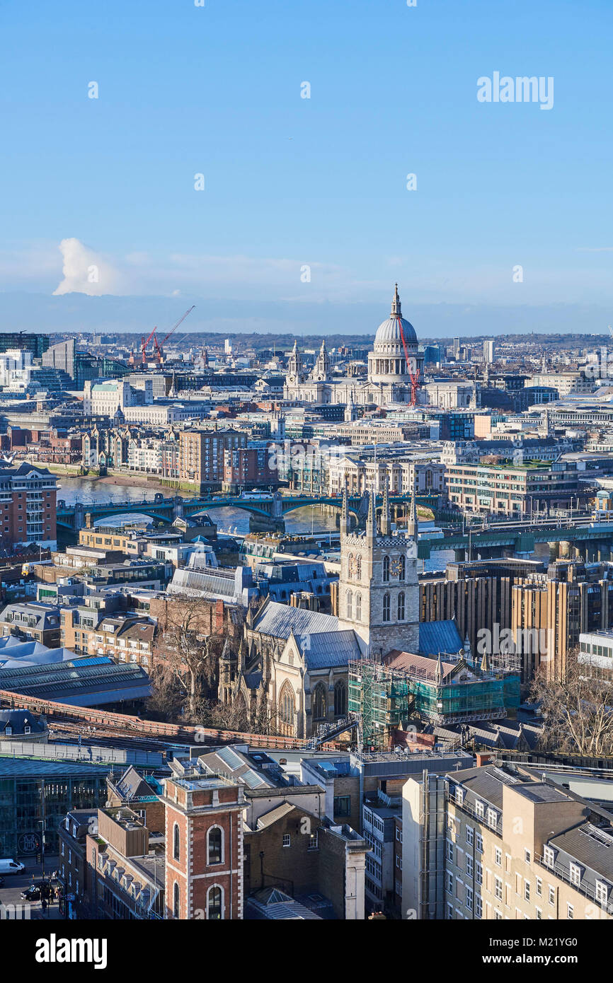 A high level view of London and the river Thames, looking up river from London Bridge, with Southwark Cathedral & St Pauls, London, UK Stock Photo