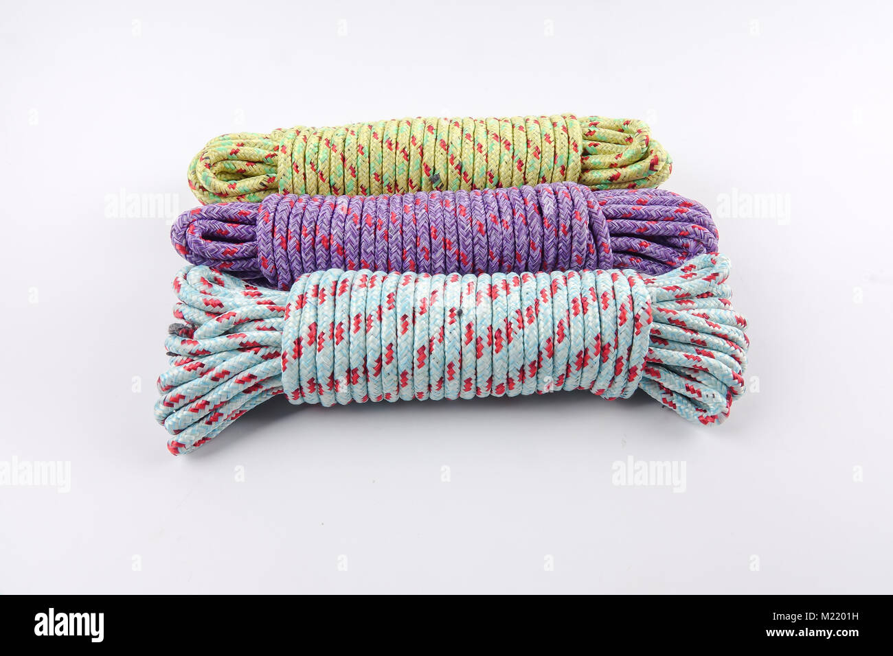 Various colour of ropes isolated on white background Stock Photo - Alamy