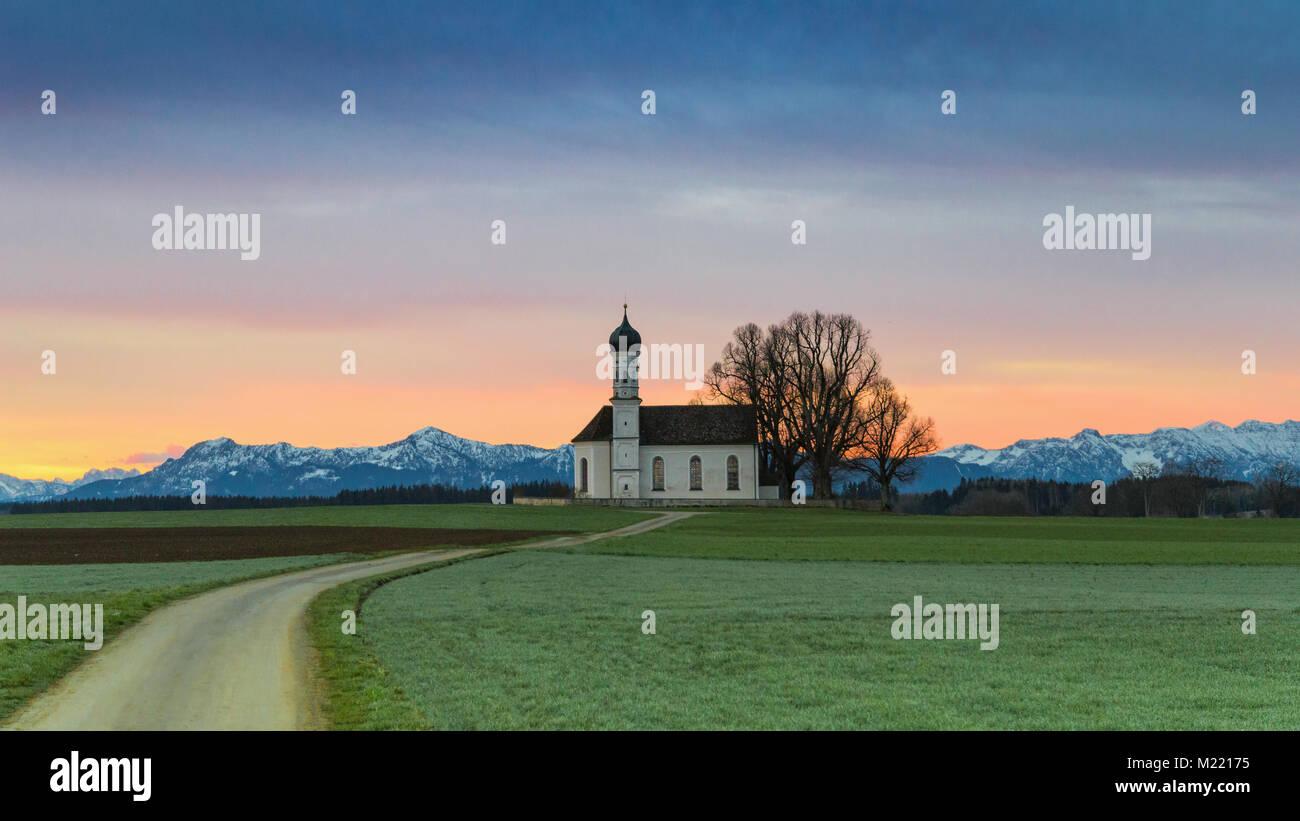 Morning Alpine landscape with sunrise over St. Andreas chapel in Etting in district Weilheim-Schongau Stock Photo