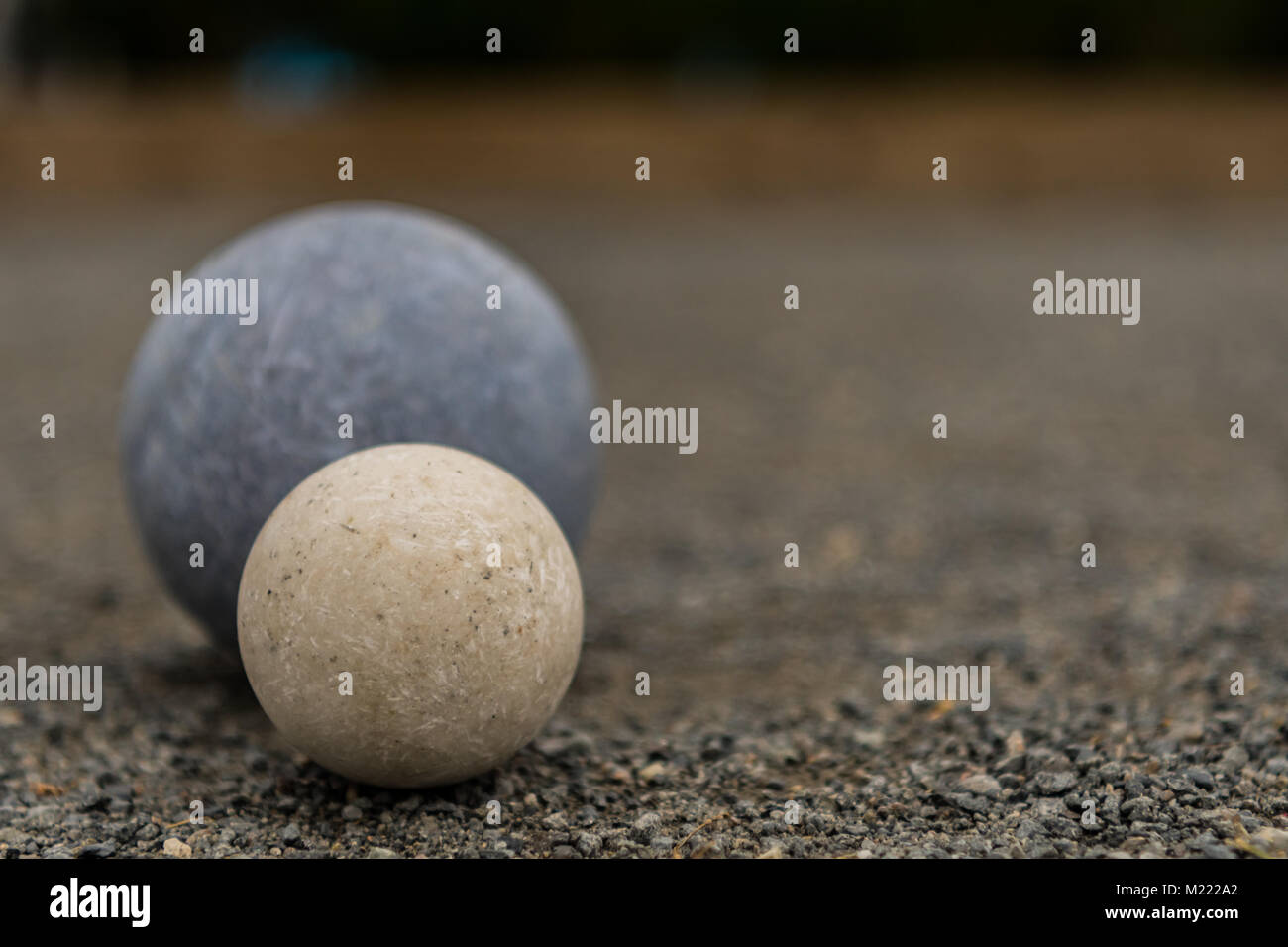 White Bocce Ball with Blue Ball Close Copy Space Right Stock Photo