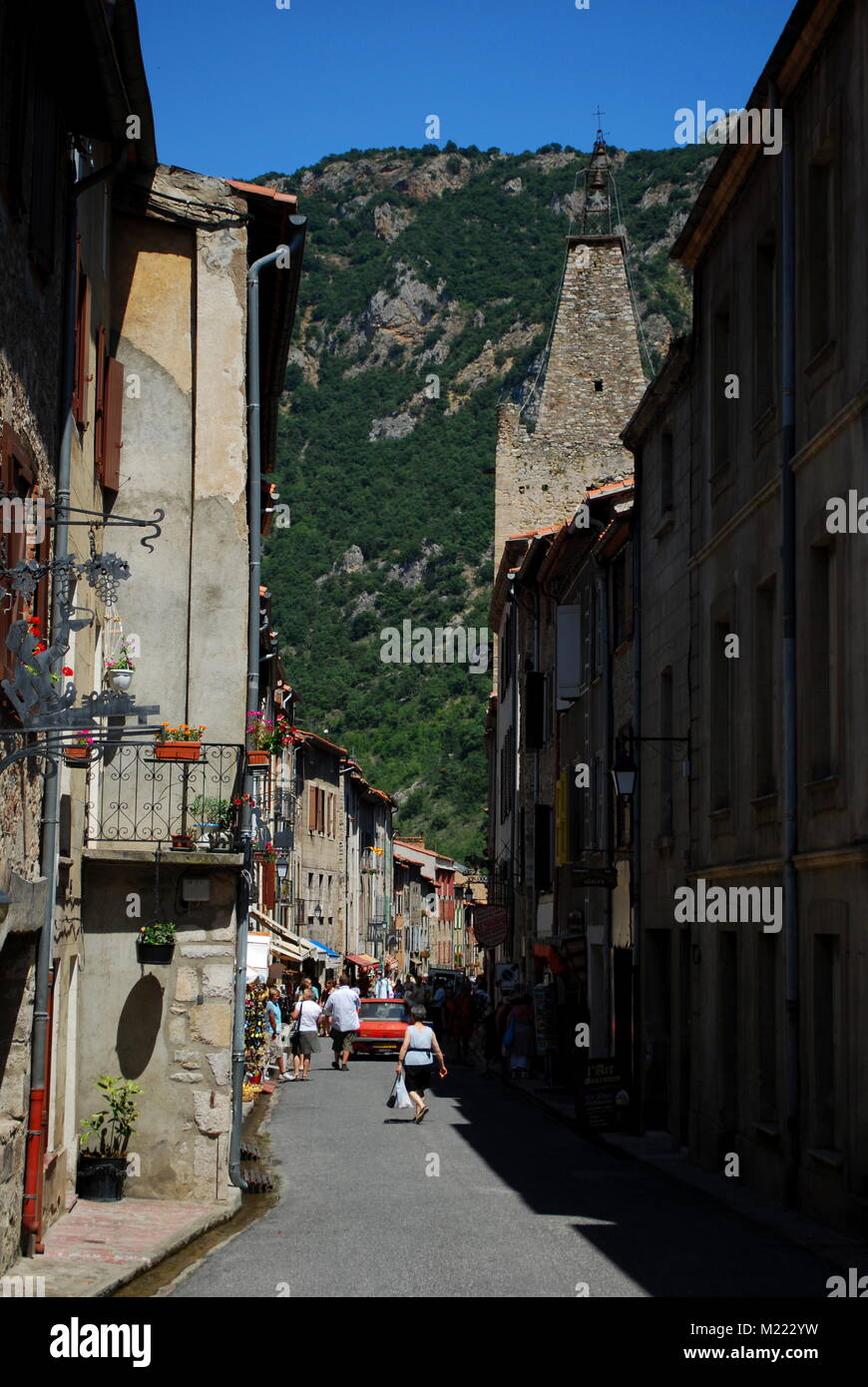A pretty street busy with tourists in the pretty walled town of Villfranche de Conflent in the south of France. This medieval city dates back to the 1 Stock Photo