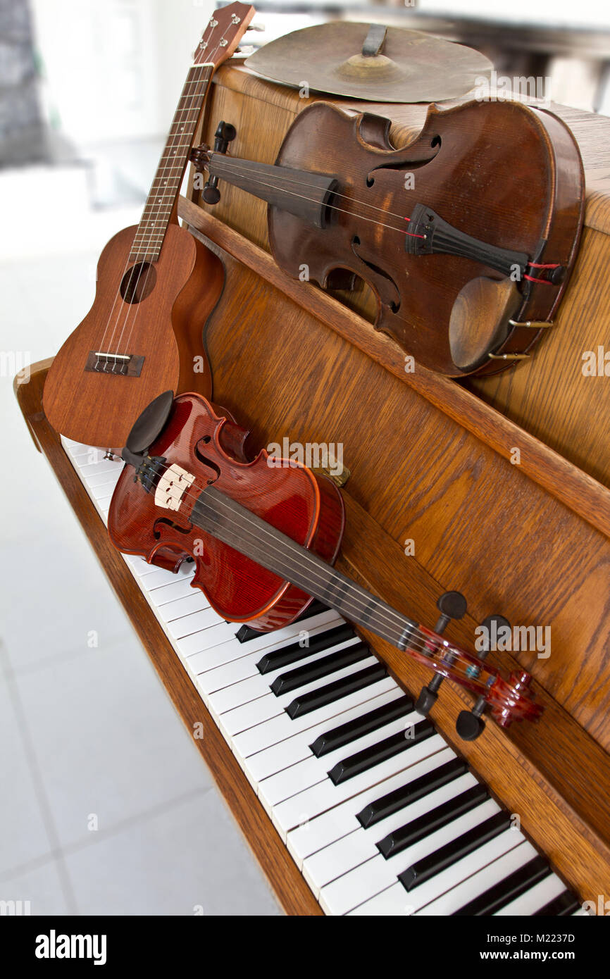 Classical violins on piano keys, guitar and cymbal. Classical musical