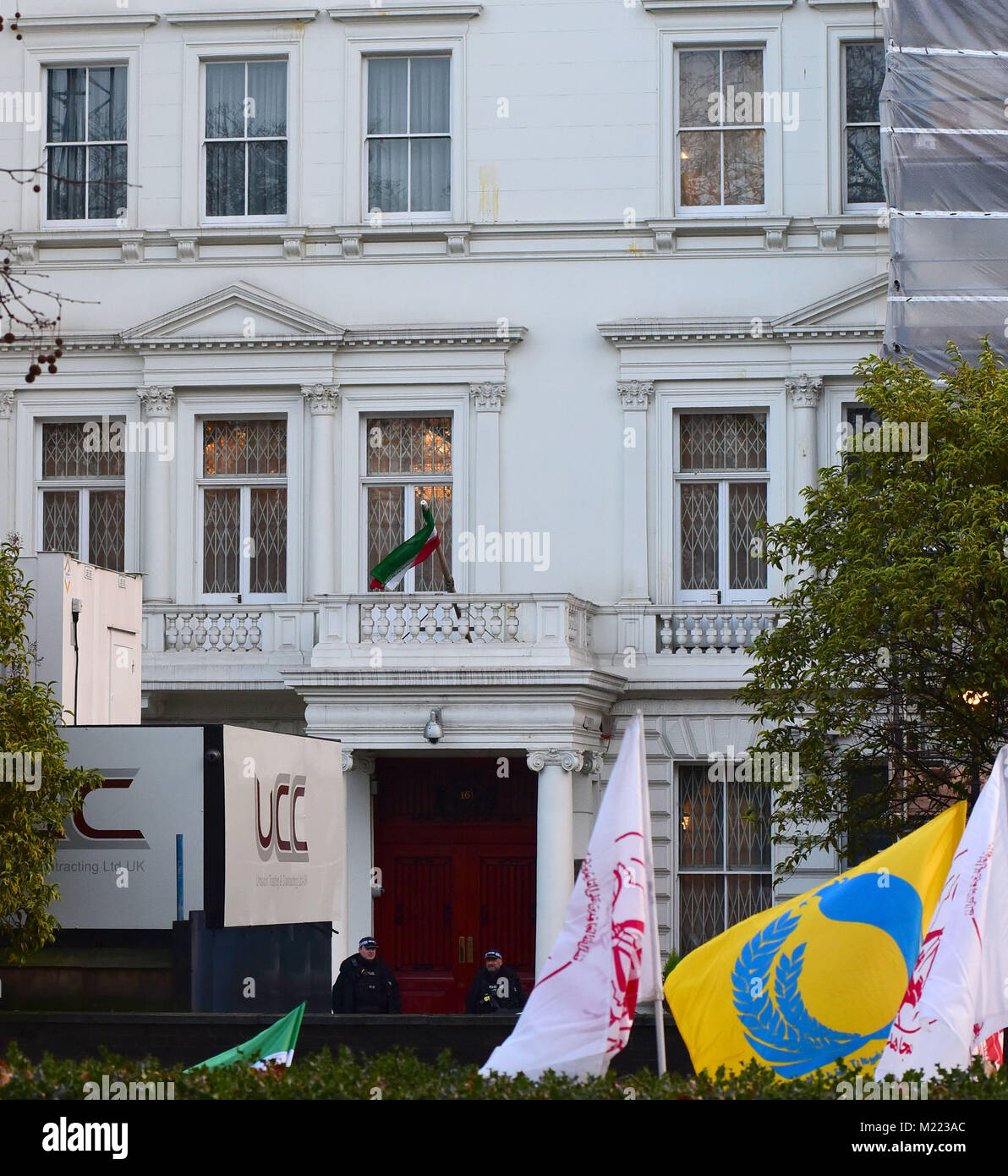 Protesters with Iranian flags gather outside the Consulate of the