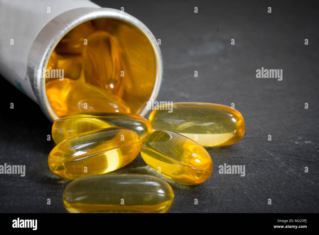 vitamin pills closeup with pill bottle Stock Photo