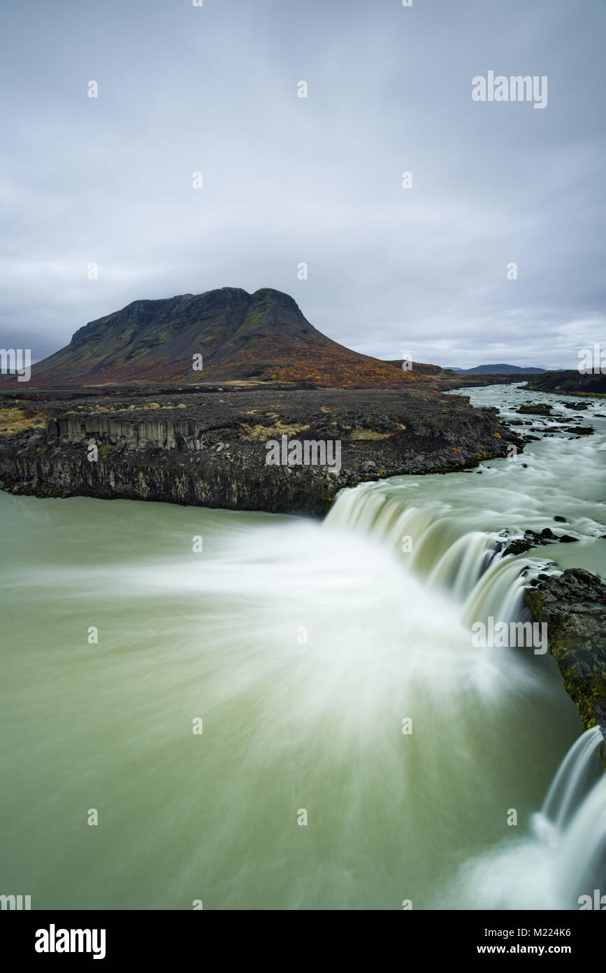 Thjofafoss or thieves falls waterfall with Mt Burfell on an overcast day in Autumn, Central Iceland Stock Photo