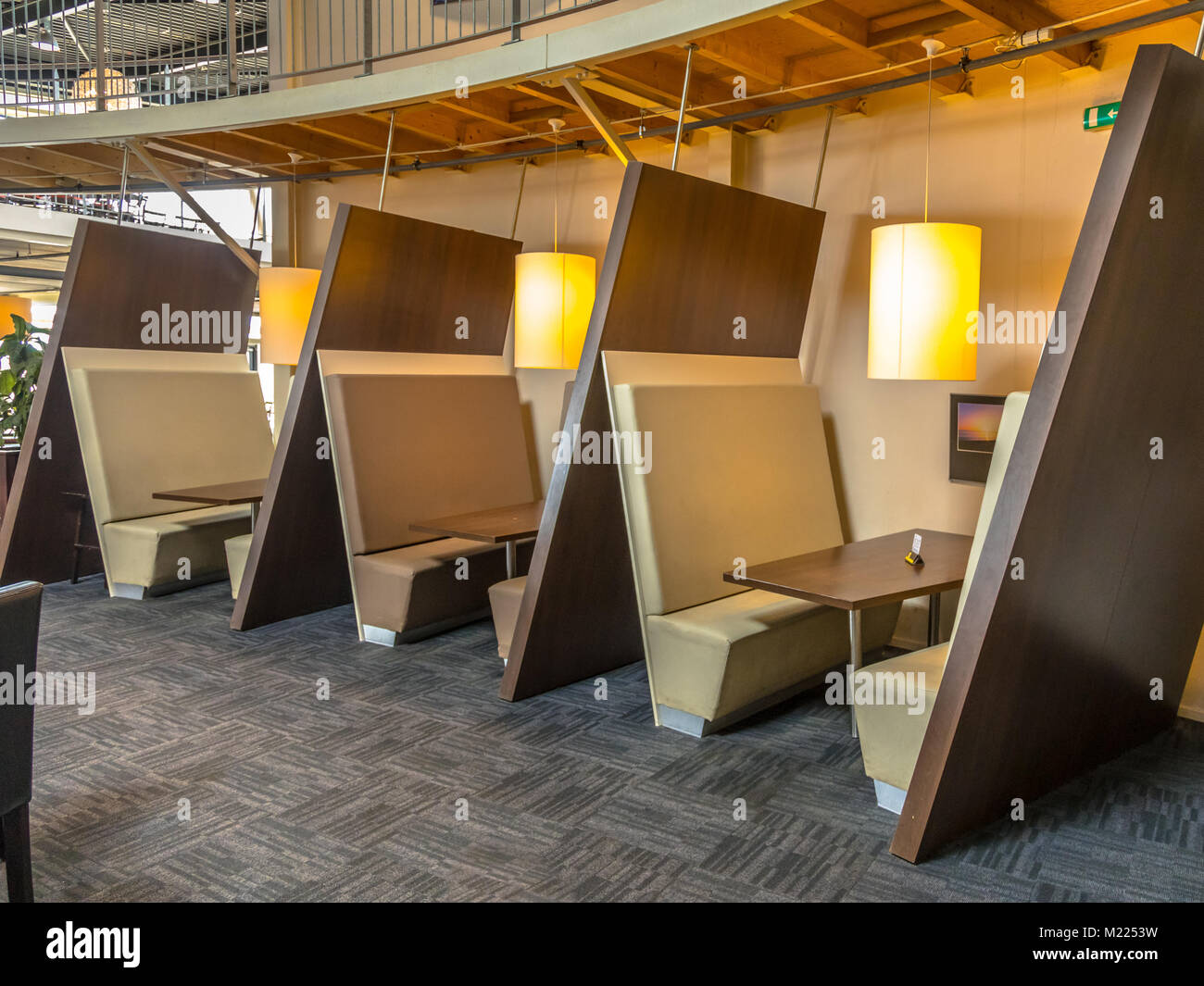 Contemporary restaurant booth seats in brown shades Stock Photo