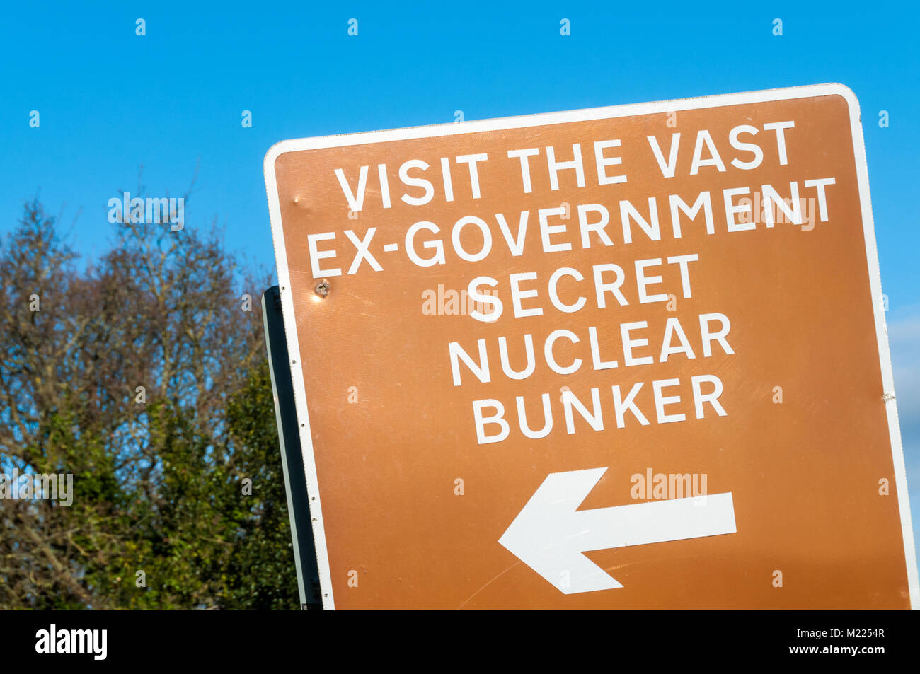 A brown tourist attraction sign for the Kelvedon Hatch Secret Nuclear Bunker in Essex Stock Photo