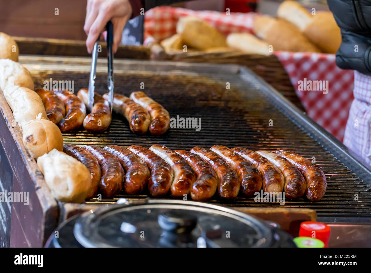 Cooking sausages on a market stall in Borough Market, London Stock Photo Alamy