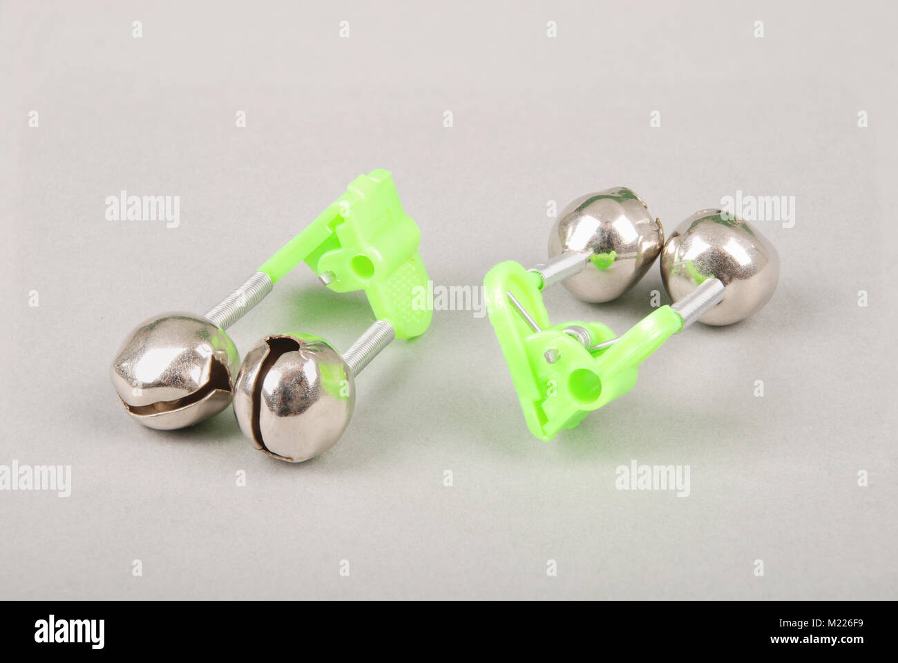 Pair of fishing bells. Bells will ring when the fish is hooked. Isolated on  grey Stock Photo - Alamy