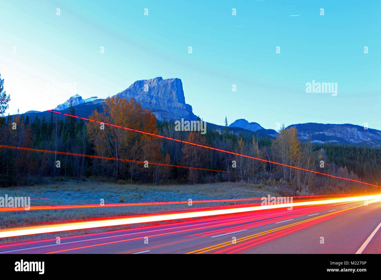 Night shot of TransCanada highway traffic through Banff National Park Stock Photo