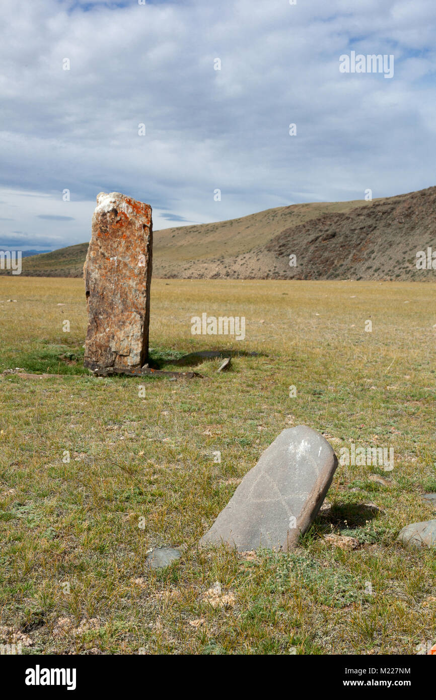 Ancient gravestones in the steppes of the Altai and Mongolia Stock Photo