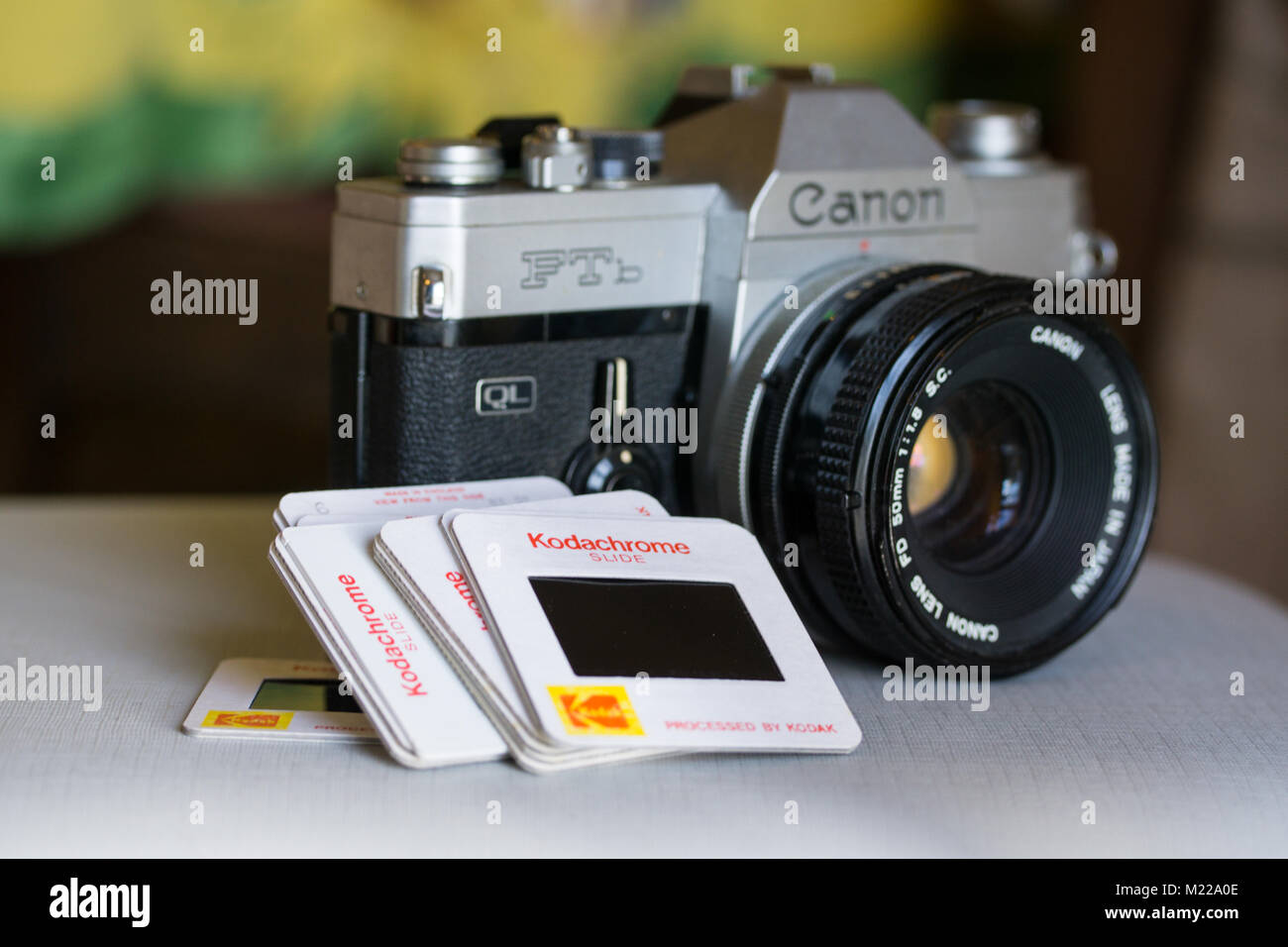 Canon FTB single-lens reflex camera with roll of kodak safety film in foreground Stock Photo