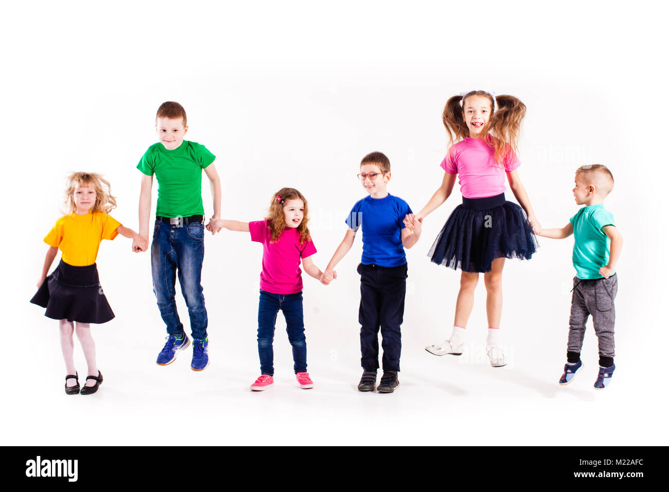 The happy kids jump Stock Photo - Alamy