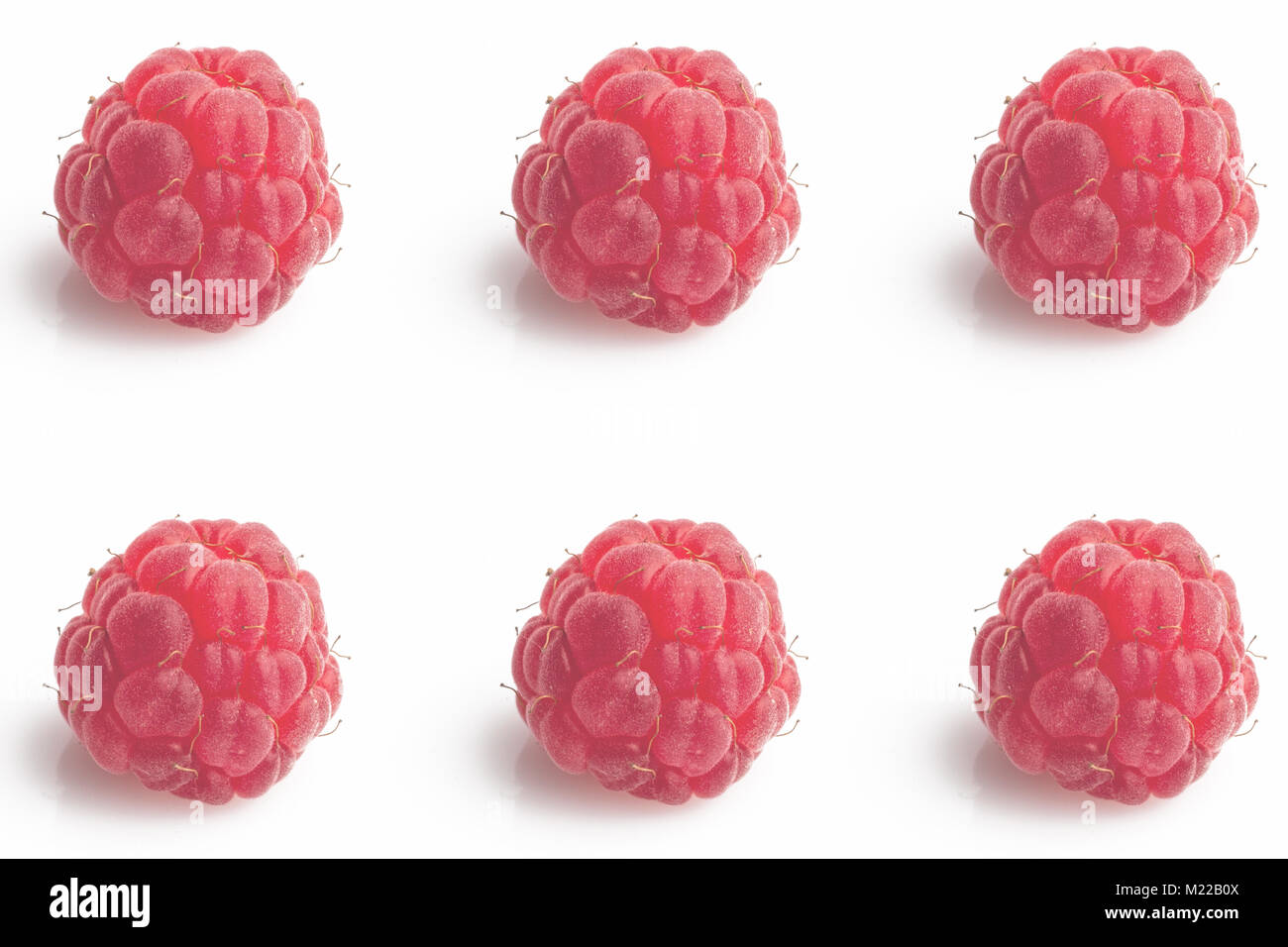 Six big lighted raspberries arranged in a symmetric pattern on white ...