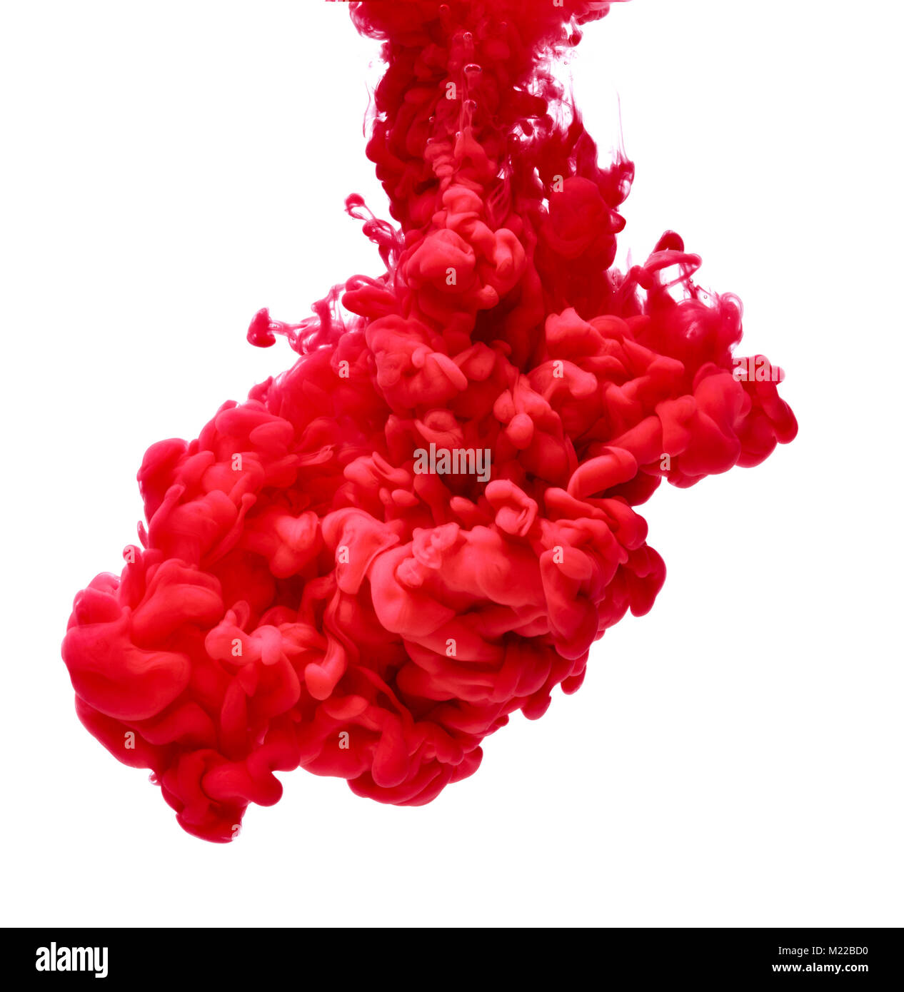 red color paint pouring in water Stock Photo