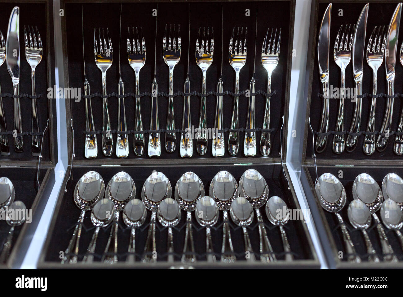 Sets of cutlery in boxes close up Stock Photo Alamy