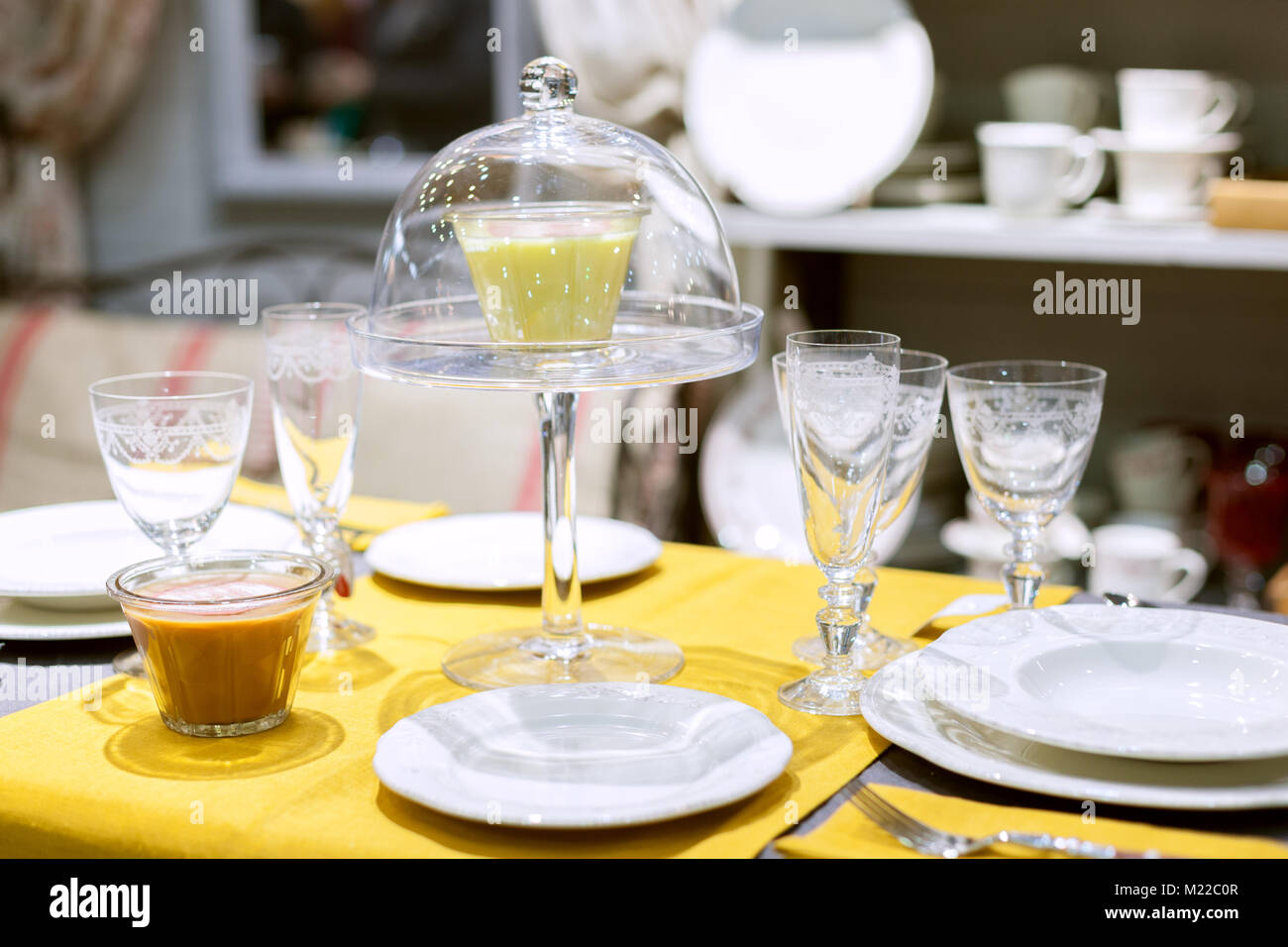 Decor table in the store for sale of dishes. Stock Photo