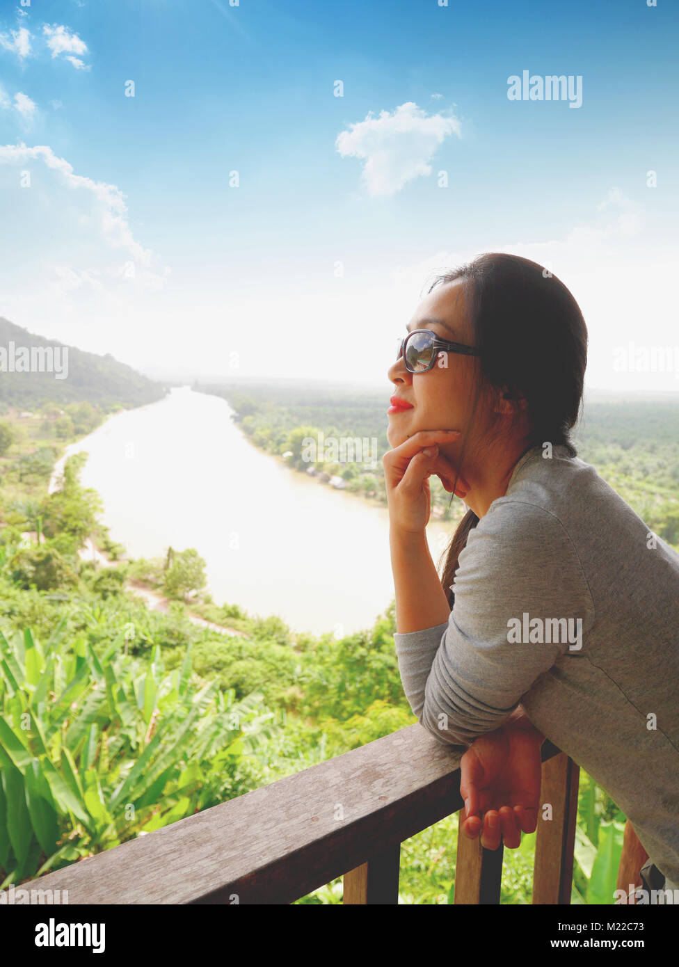 Lady with beautiful river and mountain view of Phunphin, Suratthani, Thailand Stock Photo