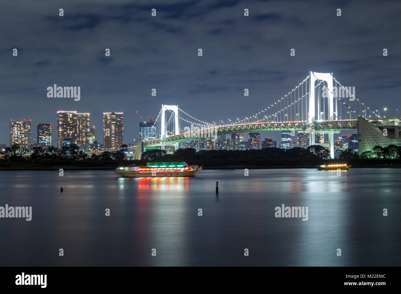 Tokyo skyline on the bay with Rainbow Bridge, shot from Odaiba Stock Photo