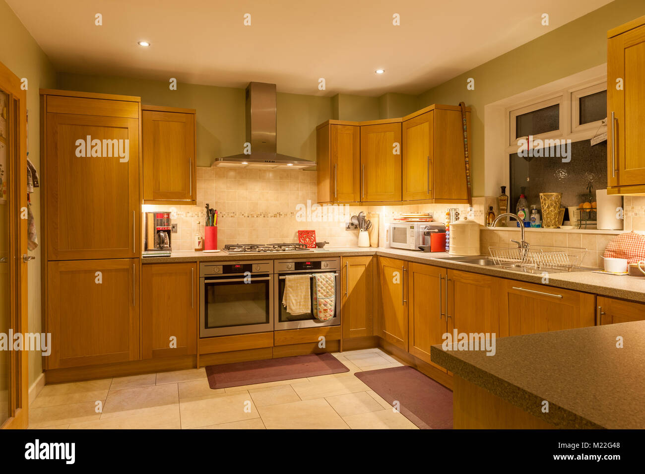 Fitted kitchen with LED lighting Stock Photo