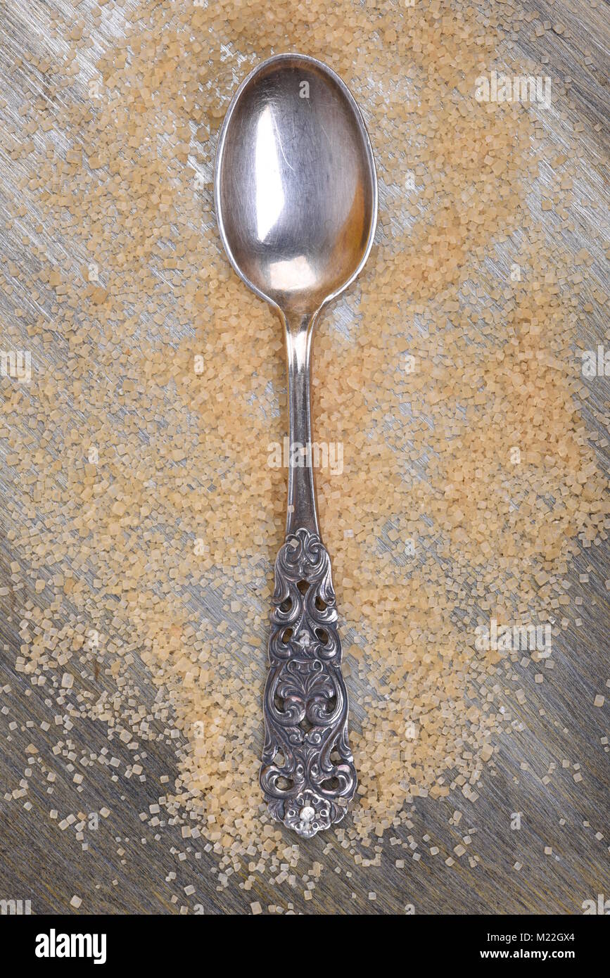 Brown suger with single spoon directly above Stock Photo