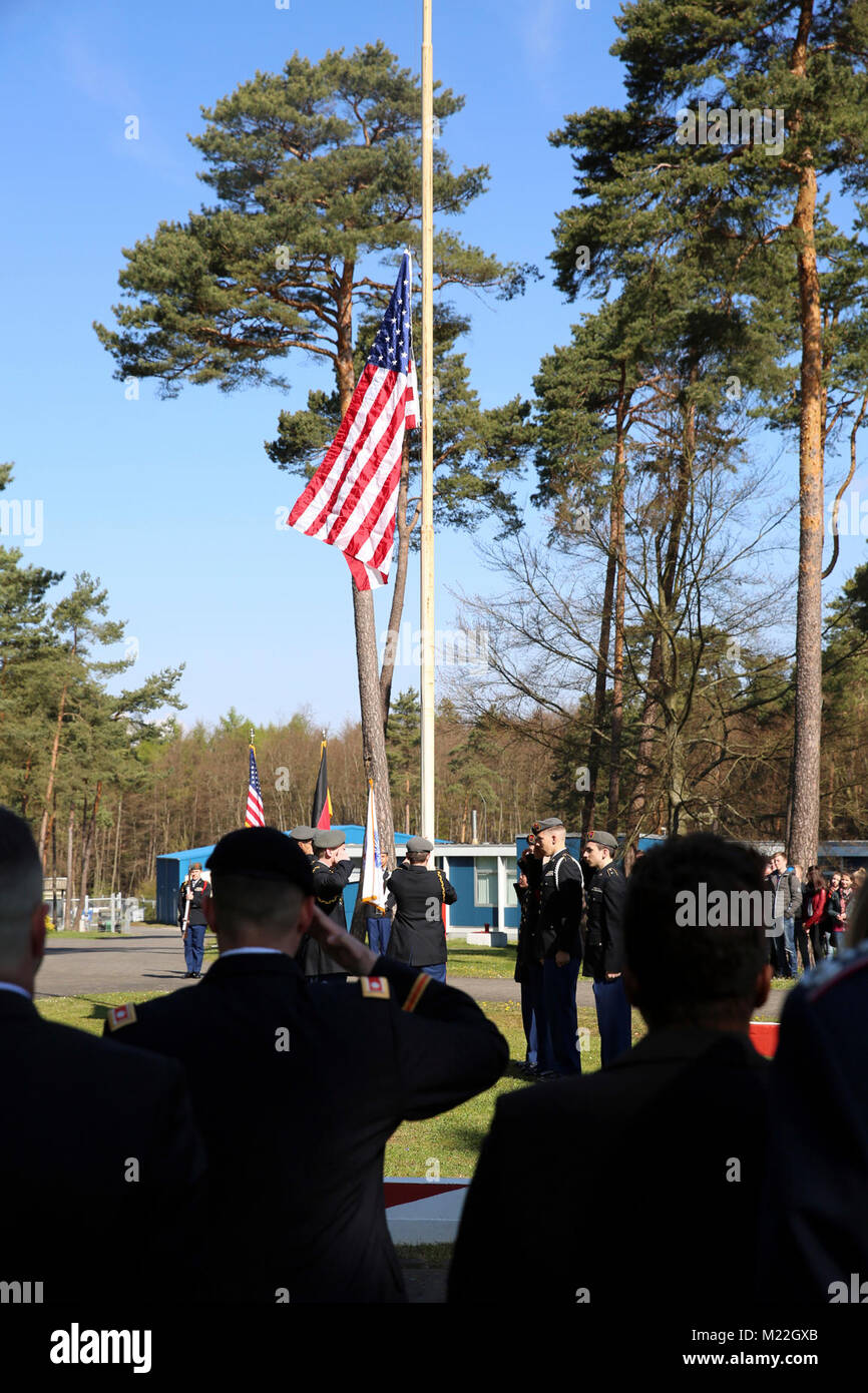 U.S. Army Lt. Col. Chris Keeshan, 2nd Signal Brigade deputy brigade commander, salutes as the American flag is raised during a ceremony marking 27 years since the last patrol along the former border between East Germany and West Germany at the Point Alpha camp, April 28, 2017 near Rasdorf, Germany. (U.S. Army Stock Photo