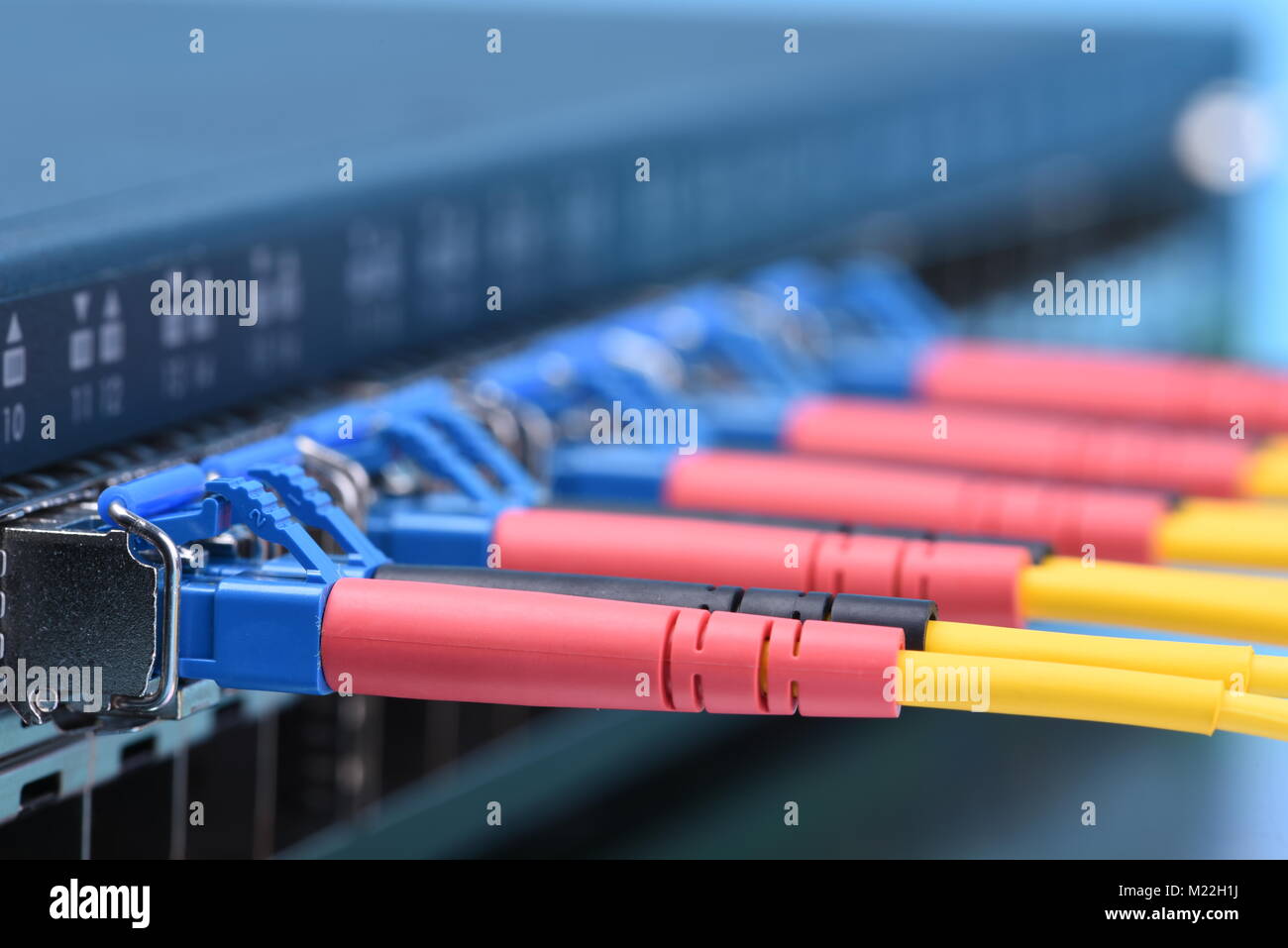 Switch with fiber optic cables in data center Stock Photo Alamy
