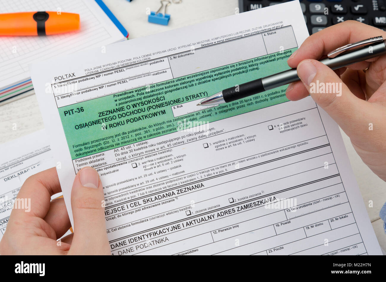 Man holding polish tax form PIT-36. Tax form law document poland business  concept Stock Photo - Alamy