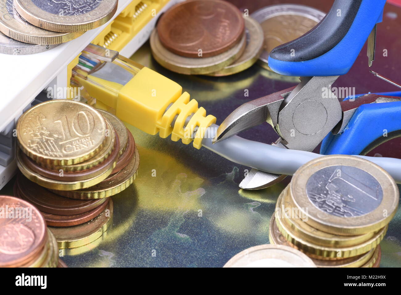 Coins and network router, paid access to the network Stock Photo