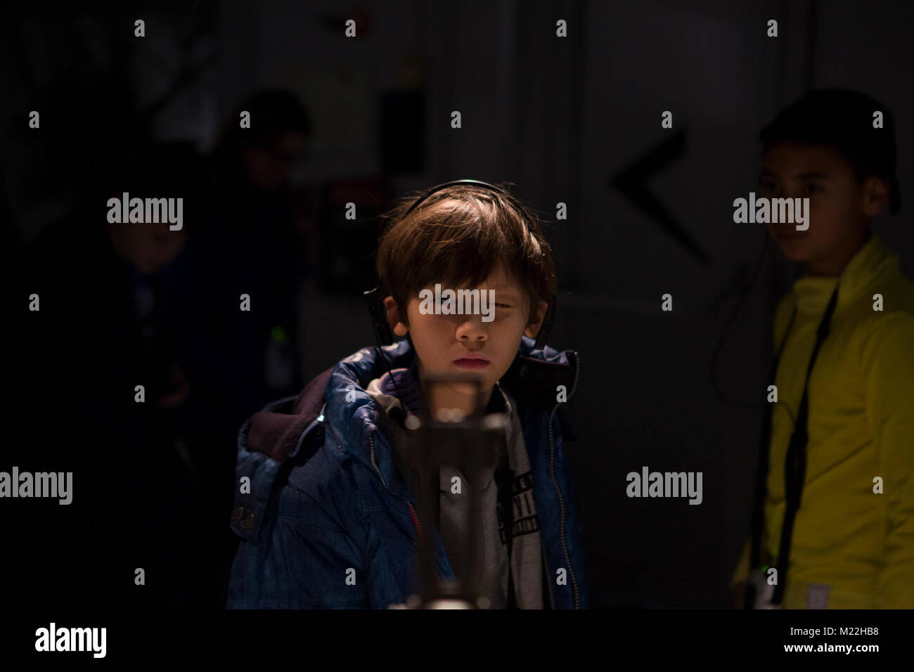 Bastogne, Belgium (Dec. 8, 2017) A student from Supreme Headquarters Allied Power Europe (SHAPE) American Middle School looks through the sights of a weapon on display at the Bastogne War Museum. The museum honors the history of events that occurred in Belgium during World War II.(U.S. Air Force Stock Photo