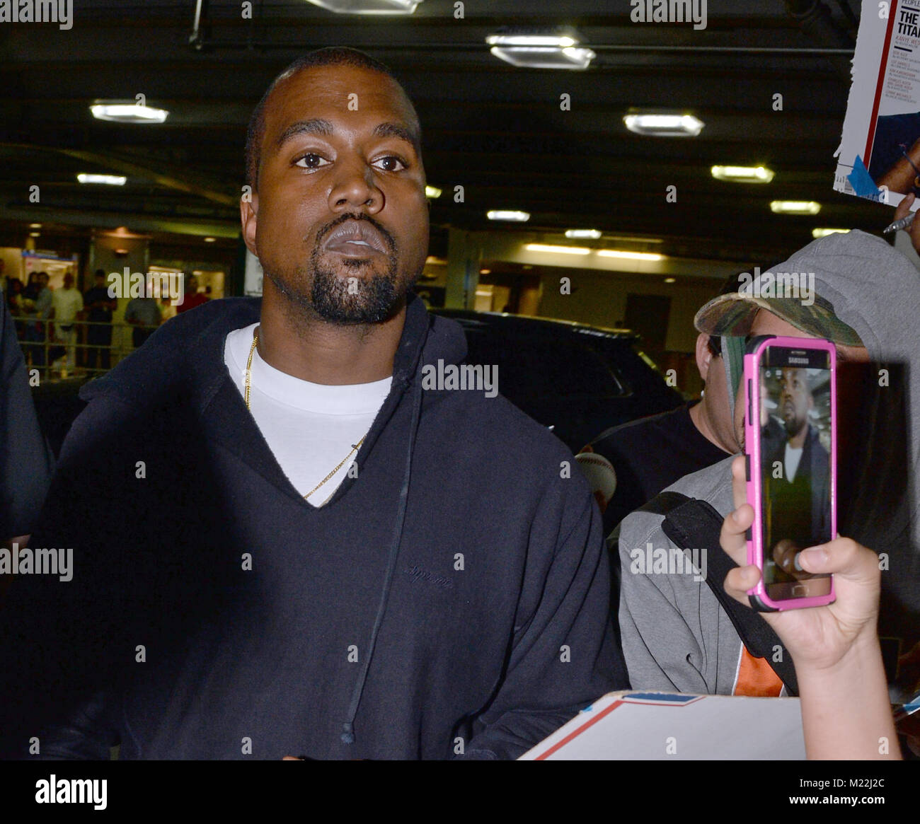 MIAMI, FL - APRIL 22: Kanye West arrives at Miami International Airport ...