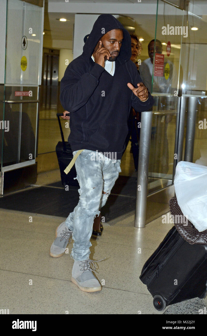 MIAMI, FL - APRIL 22: Kanye West arrives at Miami International Airport ...