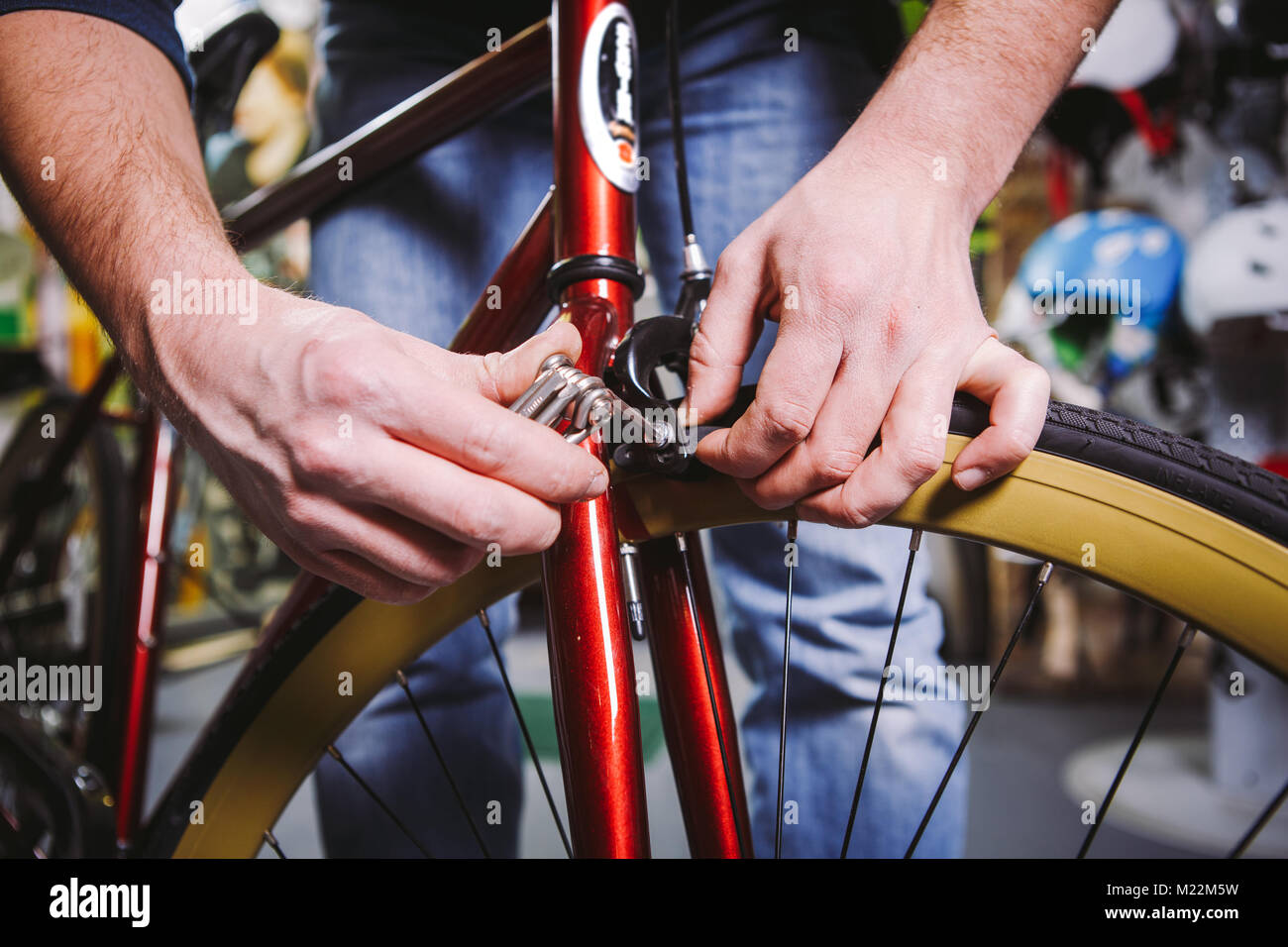 Theme repair bikes. Closeup of a Caucasian man's hand use a hand tool
