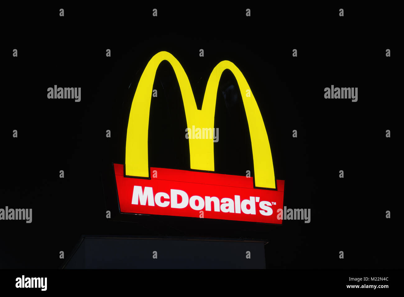 BURGAS, BULGARIA - FEBRUARY 1, 2018: McDonald's logo at night. McDonald's is the world's largest chain of hamburger fast food restaurants. Stock Photo