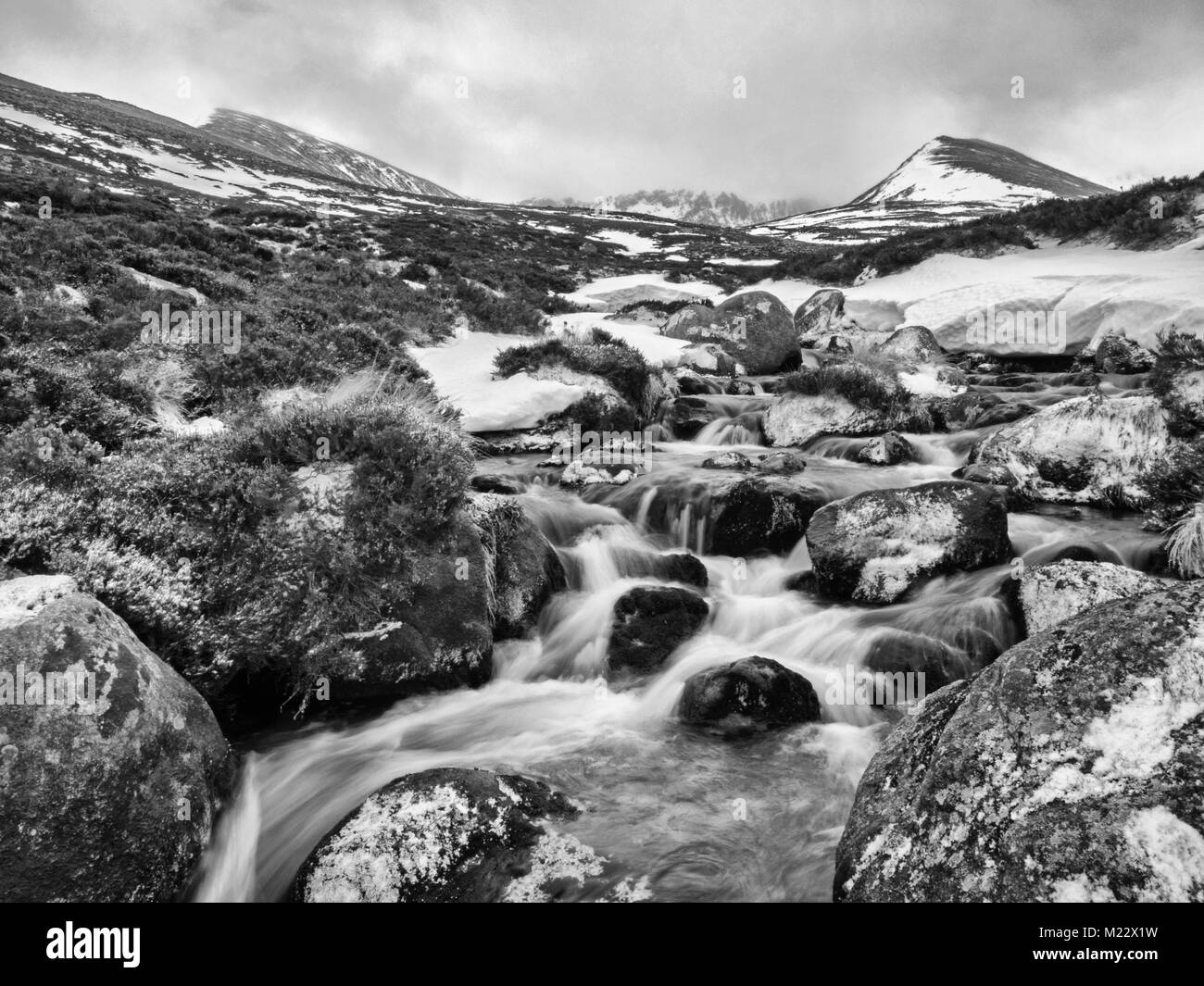 Meltwater stream tumbling down from the Cairngorm Plateau, Cairngorms National Park, Highlands, Scotland, winter Stock Photo