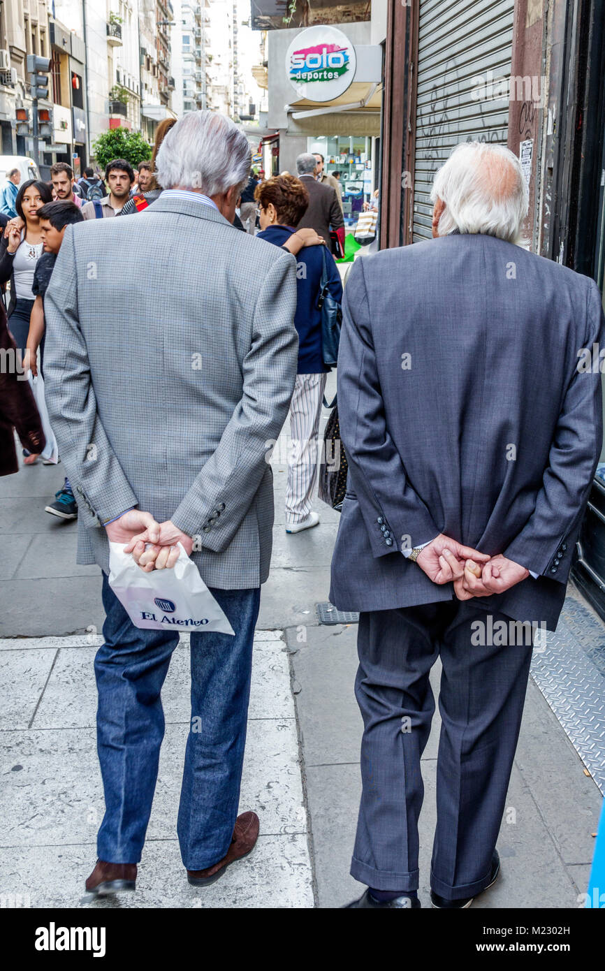 Buenos Aires Argentina,Calle Florida,pedestrian mall,promenade,senior seniors citizen citizens,man men male,wearing suit,walking,holding hands behind Stock Photo